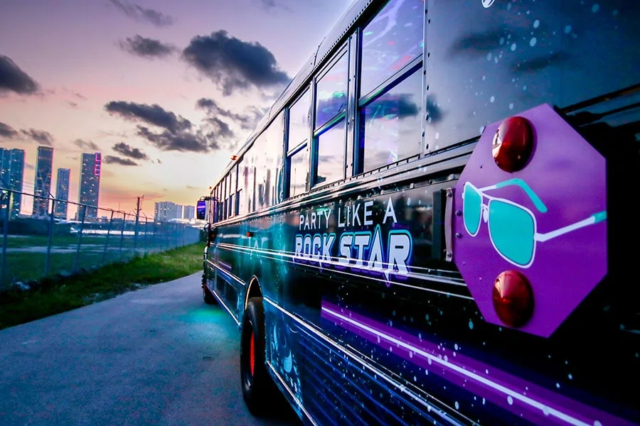 Technician repairing a party bus AC system